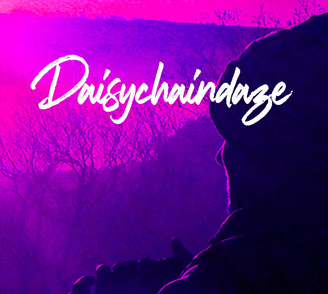 Lone figure looking out to a pink sunrise